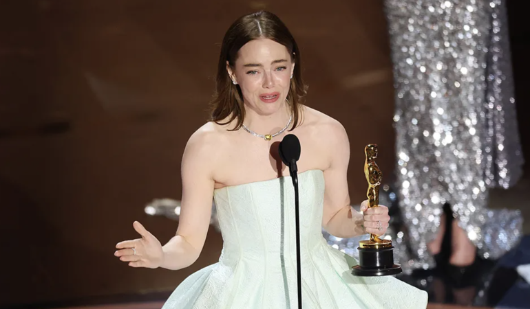Emma Stone Takes Best Actress Oscar in ‘Broken’ Gown, Jokes: “No Peeking at the Back!”