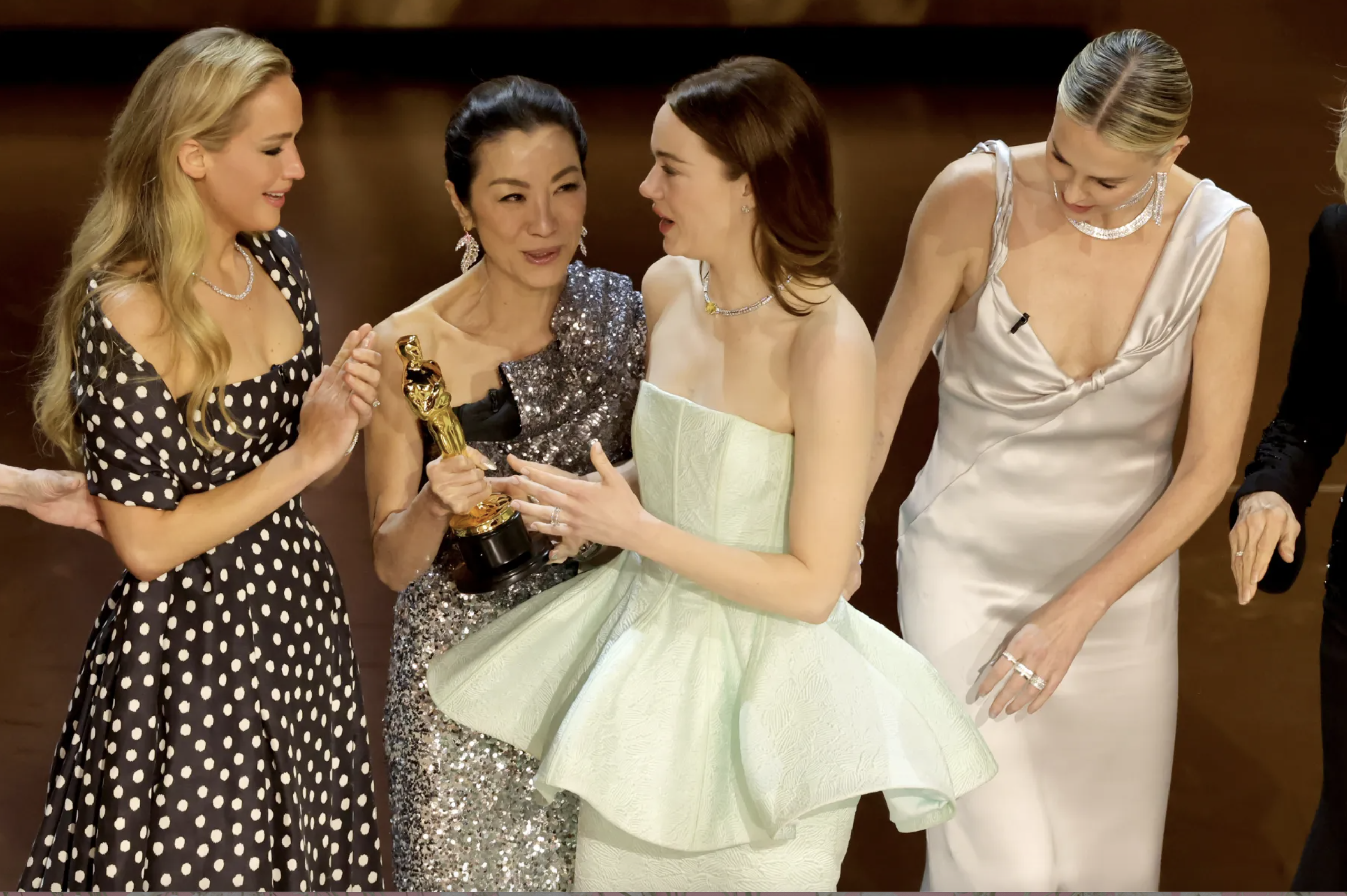 Michelle Yeoh’s Explanation for Passing Emma Stone’s Oscar to Jennifer Lawrence Takes Center Stage in Entertainment News.